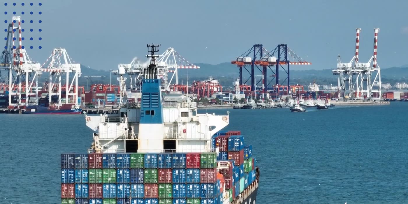 A loaded container ship leaving port